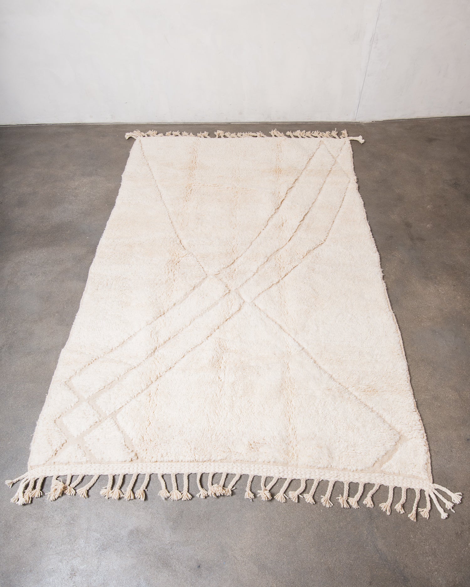 Modern, designer, handcrafted Berber rug from Morocco. Beniourain carpet with minimalist design, natural wool pile and a fluffy texture.